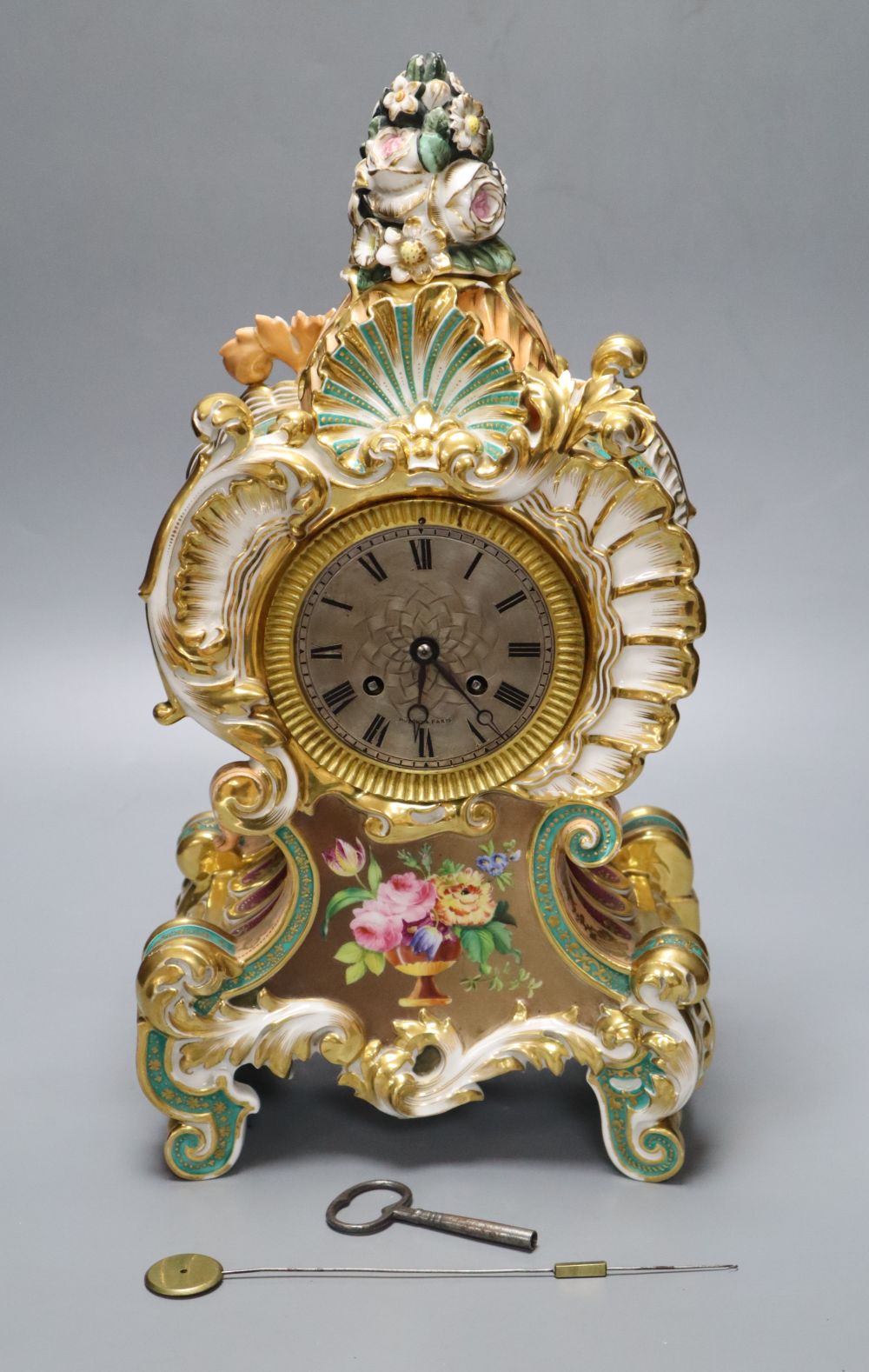 A late 19th century French porcelain mantel clock, with French movement, countwheel striking on a bell, height 40cm